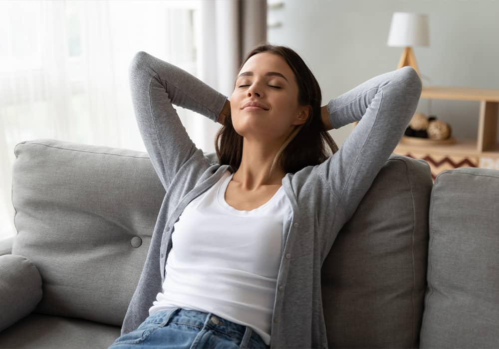 Woman relaxing on chair in a peaceful home