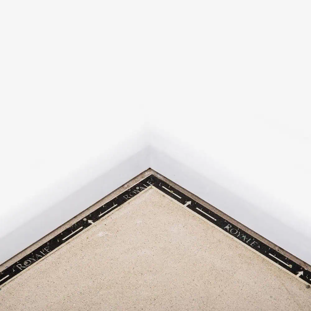 Royale professional dual-purpose black carpet gripper installed in corner of a room
