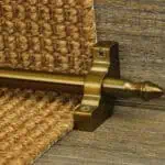 Homepride Stair Carpet Runner Rod in Bronze with a sisal carpet on wooden stairs