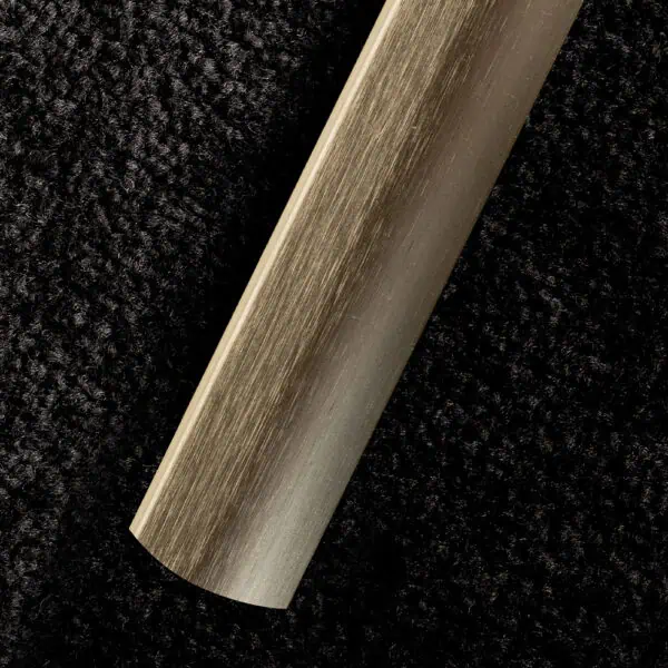 Gripperrods Premier Metal Floor to Floor Door Stick Down Cover Strip in Brushed Brass on black carpet
